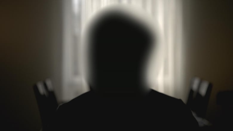 Confidential interview silhouette of former associate owner of Shoppers Drug Mart pharmacy.