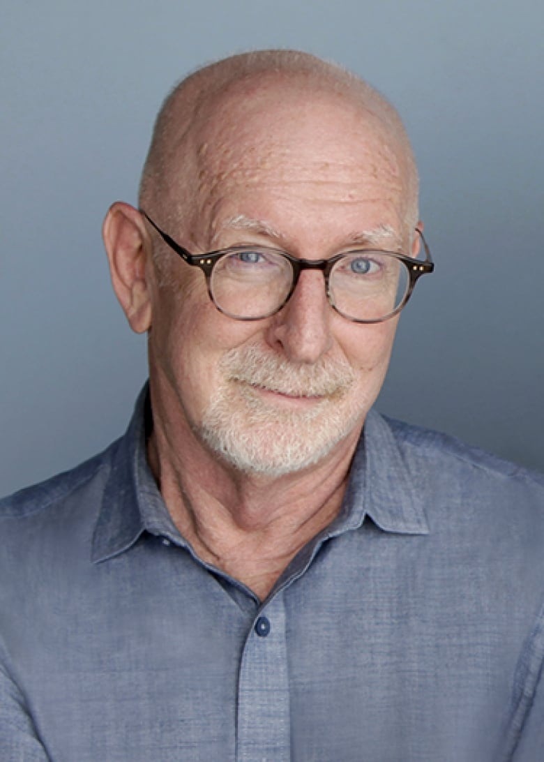 Profile pic of a Caucasian male with short white hair and brown-rimmed glasses.