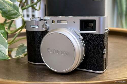 Fujifilm X100VI on a table with lens cover on