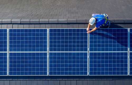 Solar panels being installed on a roof.