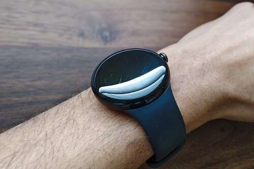 A Google Pixel Watch with scratches on the display