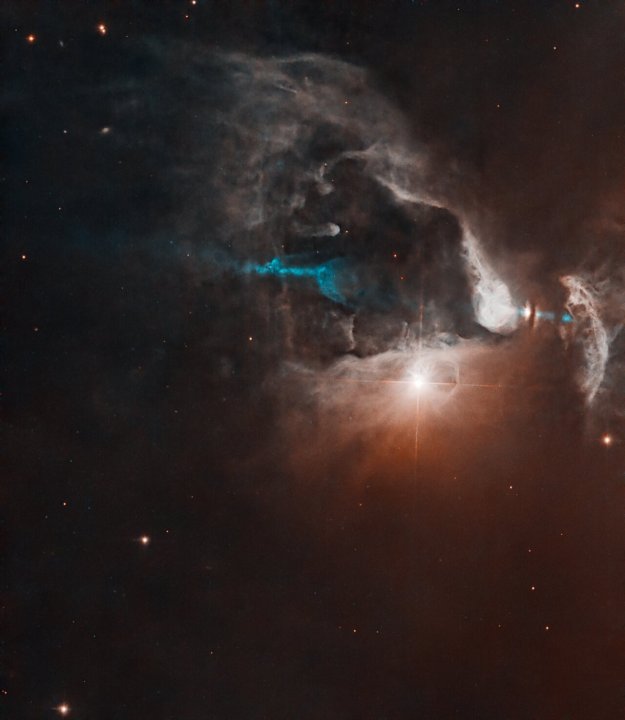 FS Tau is a multi-star system made up of FS Tau A, the bright star-like object near the middle of the image, and FS Tau B (Haro 6-5B), the bright object to the far right that is partially obscured by a dark, vertical lane of dust. The young objects are surrounded by softly illuminated gas and dust of this stellar nursery. The system is only about 2.8 million years old, very young for a star system. Our Sun, by contrast, is about 4.6 billion years old.