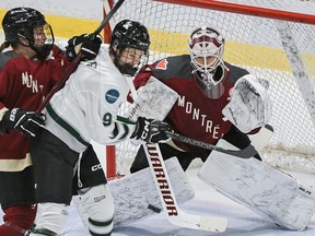 Boston's Sophie Shirley (9) moves in on Montreal goaltender Elaine Chuli as Montreal's Madison Bizal (6) defends in PWHL action in Montreal on Saturday, March 2, 2024.