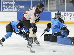 Montreal's Laura Stacey is forced wide of the net as she tries to shoot on Toronto goaltender Kristen Campbell during first period PWHL hockey action in Toronto on Friday, March 8, 2024.