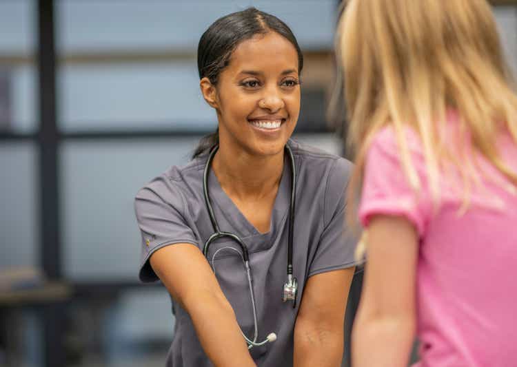 Young Girl Visiting the School Nurse stock photo