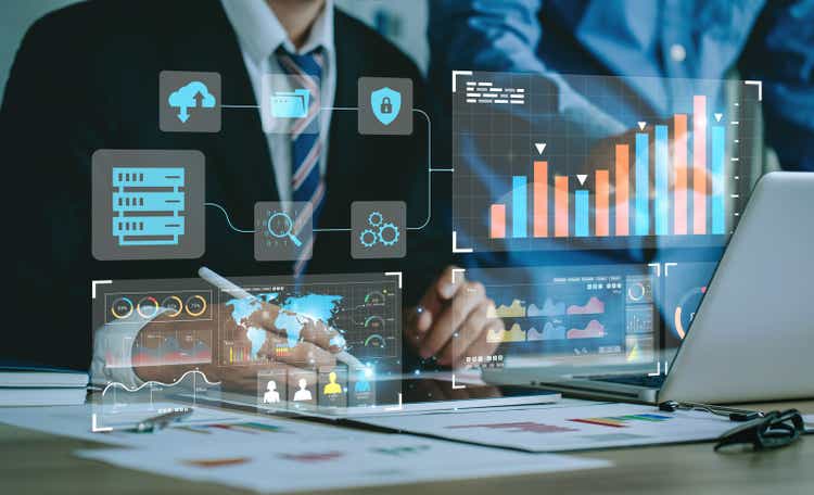 Data Management System (DMS) and Business Analytics Concept. businessman working and analysis connect to the dashboard to provide information for Key Performance Indicators (KPI), marketing analysis