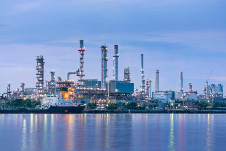 Oil and Gas plant with shipping loading dock at twilight