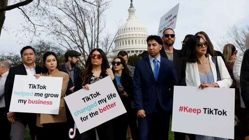 Protestors hold signs in support of TikTok outside the U.S. Capitol Building on March 13, 2024 in Washington, DC.