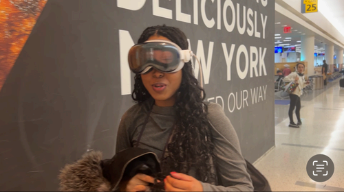 Woman wearing Apple Vision Pro at JFK airport