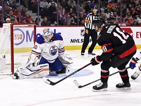 Ottawa Senators centre Tim Stutzle (18) scores on Edmonton Oilers goaltender Calvin Pickard (30) during second period NHL hockey action in Ottawa, Sunday, March 24, 2024.