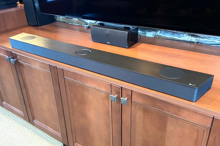 LG S95QR soundbar seen in front of a TV.