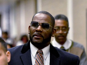 FILE - R. Kelly leaves the Daley Center after a hearing in his child support case, May 8, 2019, in Chicago. R. Kelly's lawyer told an appeals court Monday, March 18, 2024, that all kinds of legitimate organizations -- even college fraternities -- could be deemed racketeering organizations under a law unjustly used to convict the R&B superstar at his Brooklyn trial of sexually abusing young fans, including some who were children, for decades.