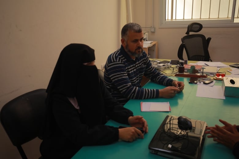 Basil Mohammed al-Habash of the Palestinian Orphan Home Association meet with staff this week.  He told CBC News his group has 5,000 children under their care.