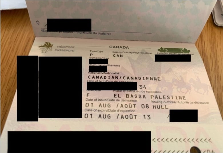 An image of a Canadian passport with some identifying information blacked out.