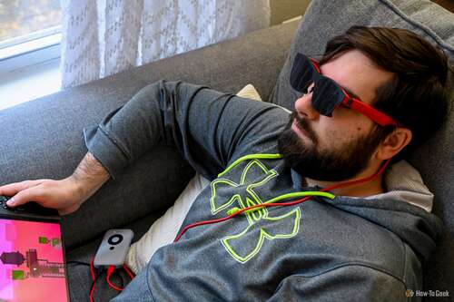 Person using the XReal Air 2 Glasses to play on a handheld gaming console.