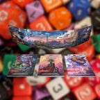 3 book covers and a GM screen on a blurry dice background