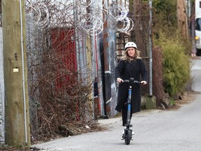 VANCOUVER, BC., March 7, 2024 - Vancouver city councillor Sarah Kirby-Yung in action on a scooter for hire, in Vancouver, B.C., on March 67, 2024. (NICK PROCAYLO/PNG) 10104084A [PNG Merlin Archive]