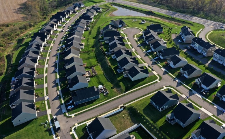 Rows of houses are shown in a subdivision.