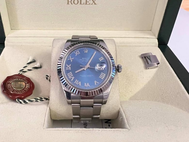 A Rolex Datejust 41 in its original box. 