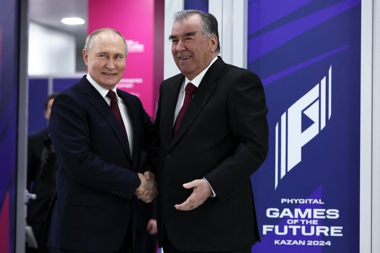 Russian President Vladimir Putin shakes hands with Tajik President Emomali Rakhmon during a meeting in Kazan, Russia February 21, 2024.