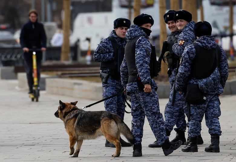 Russian law enforcement officers patrol streets in central Moscow, Russia, March 26, 2024. 