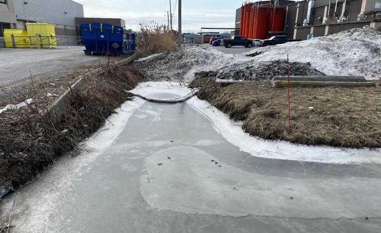 sandbags in a frozen ditch