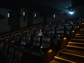 A movie buff expecting to see a South Indian action epic at a theatre in British Columbia was let down after a spate of shootings thousands of kilometres away disrupted his plans. Moviegoers sit in a theatre at a Cineplex in Toronto, Tuesday, Oct. 6, 2020.