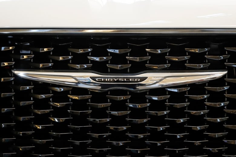 The Chrysler logo is displayed on the front grill of a car.