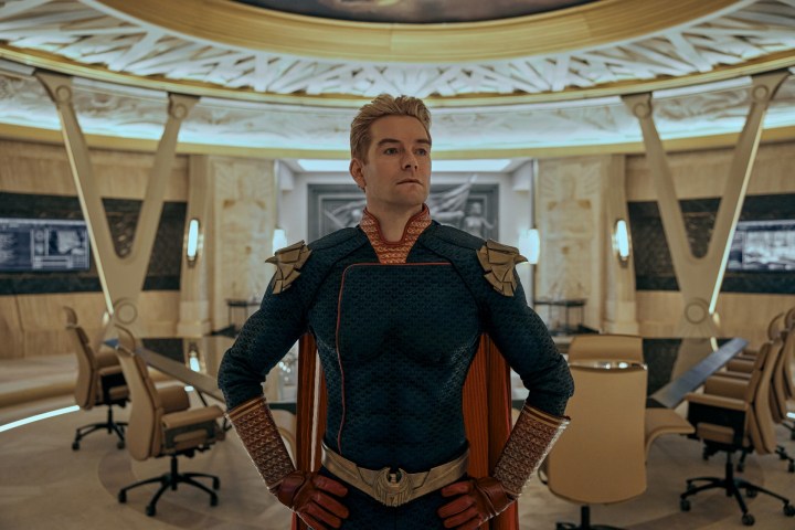 Antony Starr as Homelander stands in a room, looking concerned.