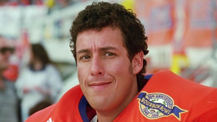Adam Sandler in a close-up wearing a football uniform in The Waterboy.