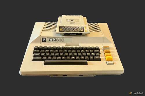 THE400 Mini sitting on top of an original Atari 800 computer