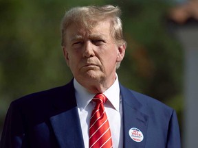 Former U.S. president Donald Trump speaks to the media after voting at a polling station setup in the Morton and Barbara Mandel Recreation Center on March 19, 2024, in Palm Beach, Fla.