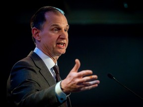 A man gestures during a press conference.