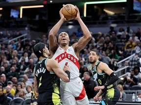 Scottie Barnes of the Toronto Raptors shoots the ball against the Indiana Pacers.