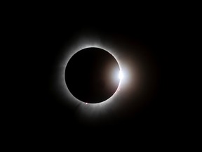 The total solar eclipse as seen from the Samuel-de-Champlain Bridge in Brossard on Monday April 8, 2024.