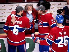 Former Canadiens GM Marc Bergevin congratulates Shea Weber, Eric Staal and Jeff Petry after the Canadiens defeated the Vegas Golden Knights to advance to the Stanley Cup final in 2021.