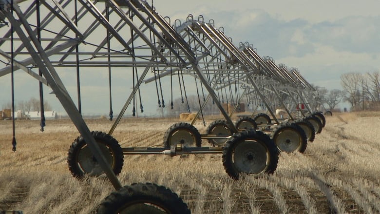 Farming equipment is pictured in a field.