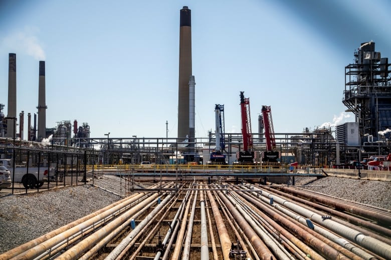 General view of the Imperial Oil refinery, located near Enbridge's Line 5 pipeline, which Michigan Governor Gretchen Whitmer ordered shut down in May 2021, in Sarnia, Ontario, Canada March 20, 2021. Picture taken March 20, 2021. Picture taken through a fence. 