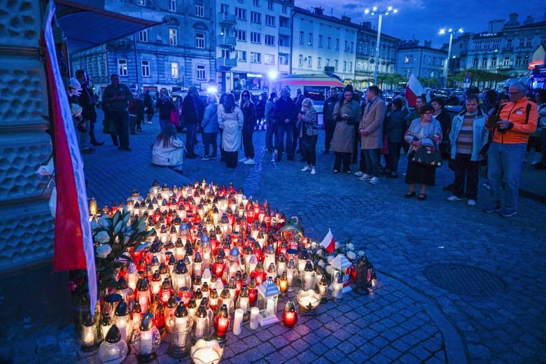 Friends and residents gather to place candles and flowers in honor of Damian Soból, a Polish food aid worker who was killed with six other World Central Kirchen workers by Israeli airstrike in Gaza this week, in Soból's hometown of Przemysl, in southeastern Poland, on Thursday, April 4, 2024. World Central Kitchen and a few other aid groups suspended operations in Gaza, after seven aid workers were killed by airstrikes. Yet despite the danger, many of the largest organizations barely slowed down. Hunger has become commonplace in Gaza amid the war with Israel, and U.N. officials warn that famine is increasingly likely in northern Gaza.