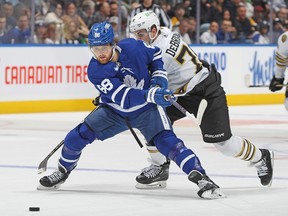 Maple Leafs' William Nylander breaks past Jake DeBrusk of the Boston Bruins during the first period at Scotiabank Arena on March 4, 2024 in Toronto.