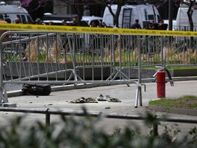 Fire extinguishers are left at the park across from Manhattan Criminal Court in New York City