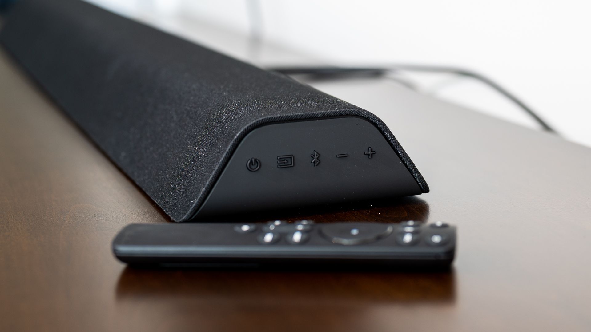 The Vizio V21D-J8 soundbar on a TV table.