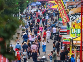 Crowds move through the Calgary Stampede grounds on Friday, July 14, 2023.