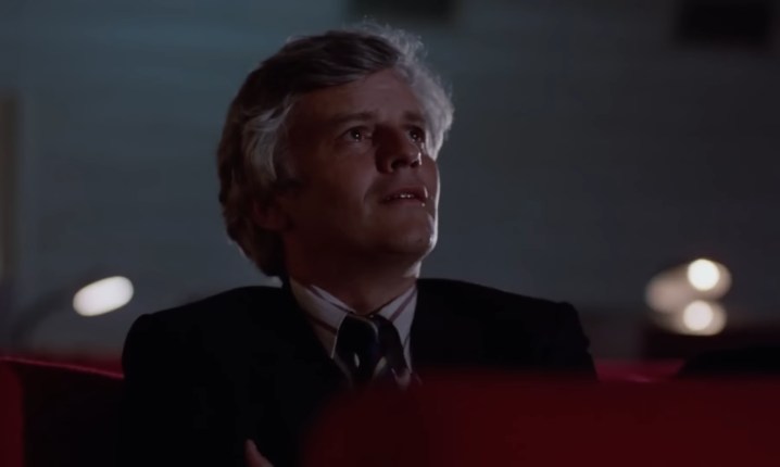 Salvatore in a movie theater in "Cinema Paradiso."