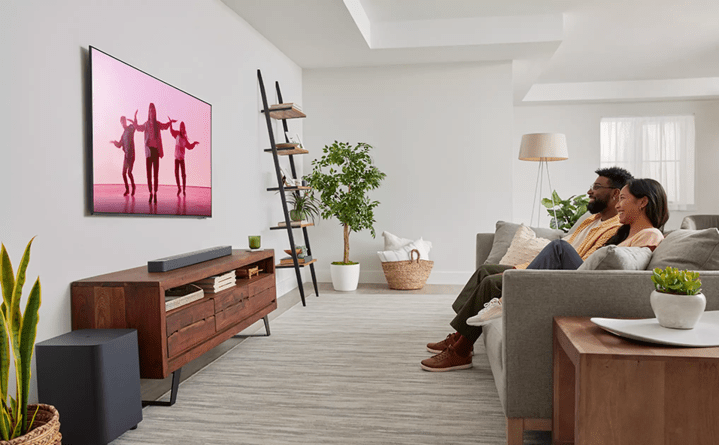 The JBL Bar 500 and Subwoofer hooked up to a TV in a living room.