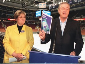 Ontario Premier Mike Harris, right, and Social Services Minister Janet Ecker announce welfare reforms.