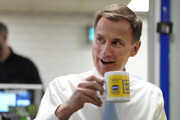 Jeremy Hunt drinking from a mug