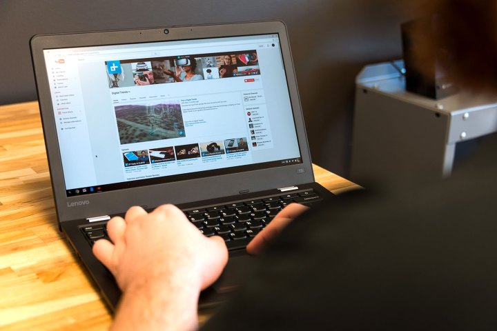 A person using the Lenovo Thinkpad-13 Chromebook.