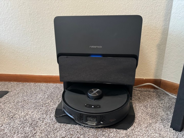 Roborock S8 MaxV Ultra Dock placed on grey carpet.