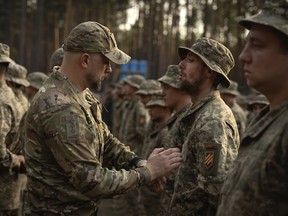 Newly recruited soldiers mark the end of their training at a military base close to Kyiv, Ukraine, on Sept. 25, 2023.